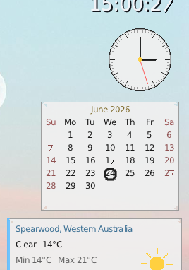 Desktop widgets: analog and digital clock, a month calendar and a weather panel.